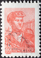 SOVIET UNION, USSR - CIRCA 1958: a postage stamp from SOVIET UNION, USSR , showing a steel worker with glasses in front of steel containers. Circa 1958