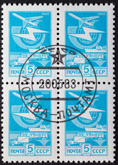 SOVIET UNION, USSR - CIRCA 1982: a postage stamp from SOVIET UNION, USSR , showing Postal Transport via plane, ship, railroad, truck and a globe with lightning.Circa 1982.