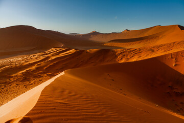 Landscape of orange sand dunes in Namibia