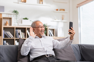 Asian elderly man making video call on smart phone, online call,  digital technology service...