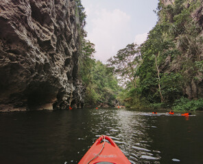 Amazing Nature landscape view of kayaking on the river flowing through the cliff at Pha Hob in Mae Moh, Lampang, Thailand. Adventure travel concept