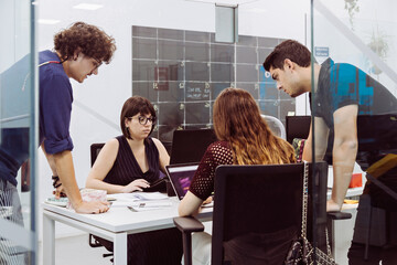 Meeting of young people in office discussing project