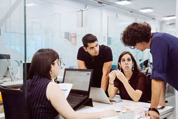 Meeting of young people in office discussing project