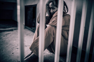 Portrait of women desperate to catch the iron prison,prisoner concept,thailand people,Hope to be...