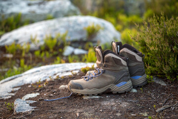 trekking boots standing on a stone