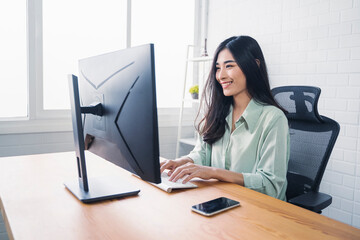 Beautiful Asian business woman in business conference meeting online video call network connection work from home, planning strategies using computer technology, thinking smiling, modern office
