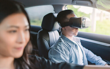 Asian woman driving car simulation virtual reality headset taking driving test examination new car owner car, happy cheerful smiling excited salesman sold car dealership taking for test drive buy car