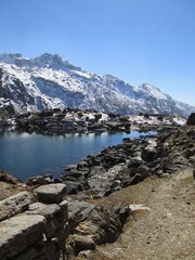 Fototapeta na wymiar View of Gosaikunda Lake. Extreme Trekking in the Himalayas, sport in the mountains. Holiday destination. Gosainkunda in Langtang National Park, travel to Nepal