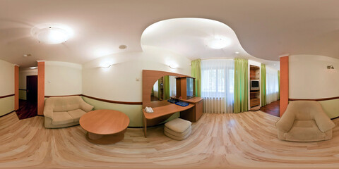 seamless 360 panorama in interior of living room of cheap hotel,  flat or apartments with sofa chairs and tv in equirectangular projection with zenith and nadir. VR AR content