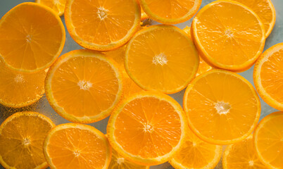 Healthy natural product. Orange slices on a light background. Juicy citrus fruits. Top view