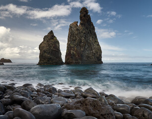 A beautiful beach with black rocks