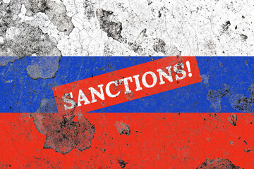 Distressed russia flag with red sanctions label on a damaged old concrete wall surface