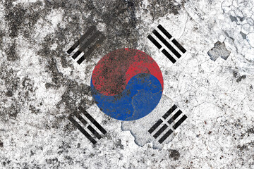 South korea flag on a damaged old concrete wall surface
