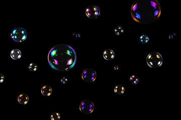 Soap bubbles isolated on a black background.