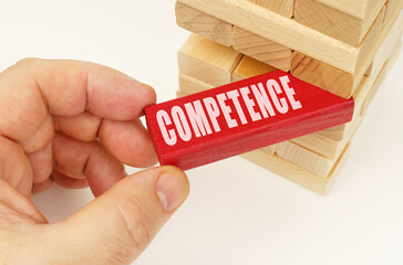 From the tower with wooden planks, they take out a red plaque with the inscription - Competence