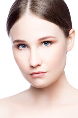 Obraz premium Beauty face of young woman with clean skin. Perfect skin, blue eyes, brunette hair, nude natural makeup. Skincare facial treatment concept