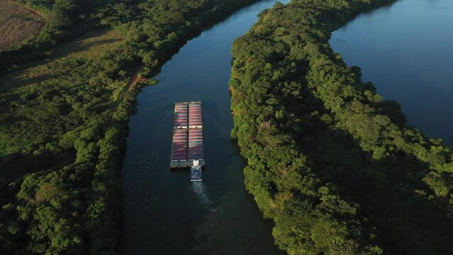 grain barge going up the tiete-parana waterway, on the tiete river