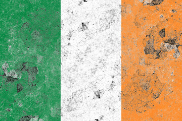 Ireland flag on a damaged old concrete wall surface