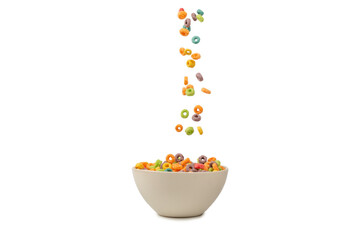 Colorful cereal box for morning breakfast. Corn flakes falling to the white bowl. Motion.