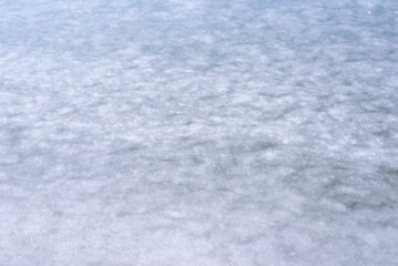 Natural texture of ice, frozen lake  as  background.