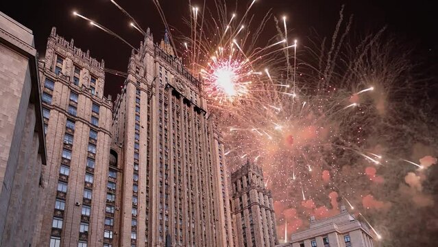 Celebratory colorful fireworks and  Ministry of Foreign Affairs of the Russian Federation, Moscow, Russia  (time lapse, with zoom) 
