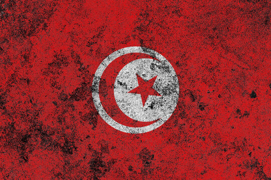 Tunisia flag on a damaged old concrete wall surface
