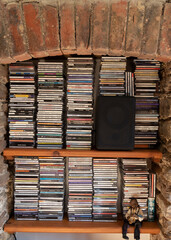 Bigbury, Devon, England, UK. 2022. Large collection of CD's in an alcove.