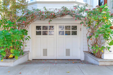White garage exterior with double side hinge door at San Francisco, California