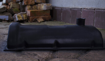 An auto mechanic is working on a car engine in a mechanics garage. Repair service. authentic close-up shot. VAZ 2106