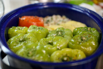 Filled green peppers and tomato with rice cooked in the hull together with chopped potatoes