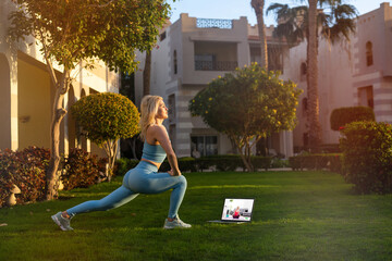 girl practice yoga outdoor. Healthy lifestyle. Woman wear sportswear in yard of resort hotel