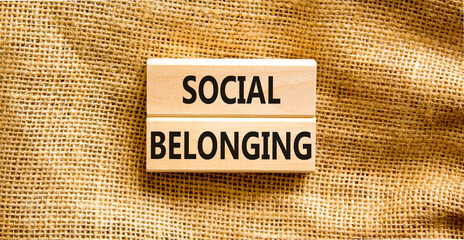 Social belonging symbol. Wooden blocks with concept words Social belonging on beautiful canvas background. Business political social belonging concept. Copy space.