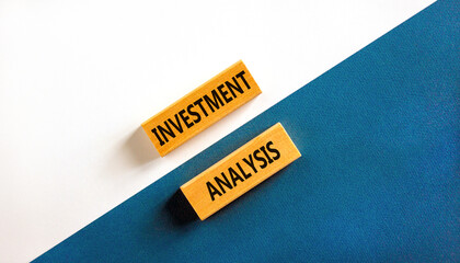 Investment analysis symbol. Wooden blocks with concept words Investment analysis on beautiful white and blue background. Business investment analysis concept. Copy space.