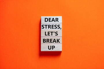 Stress break up symbol. Concept words Dear stress let is break up on wooden blocks. Beautiful orange table orange background. Business motivational stress break up concept. Copy space.