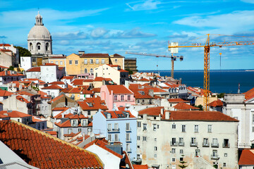 Aerial view of the red roofs of Alfama the historic area of Lisbon on the coast of the Atlantic...