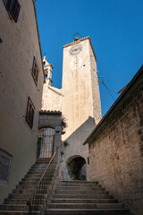 Fototapeta premium Clock tower and bell tower of the church of Saint Rocco in the old town of Omis, Croatia