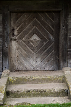 Croatia, April 20,2022: Old wooden rustic doors on rural home wall.