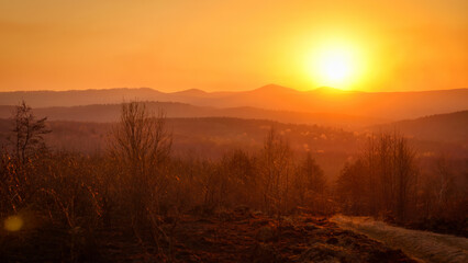 Fototapeta na wymiar Bright sunset or dawn in a mountainous area