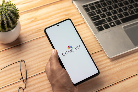 West Bangal, India - April 20, 2022 : Comcast logo on phone screen stock image.