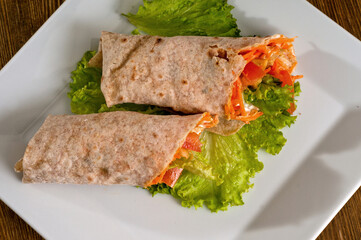 Vegetables with sour cream, wrapped in bread of pita