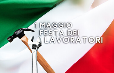 1 May Workers Day labor day text in italian. Italy flag, Hammer and wrench - grunge abstract image