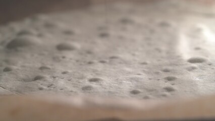 Close-up baking puff pastry cake for the classic Napoleon cake. Dessert in a home oven, macro video of how the puff pastry rises. 4K.