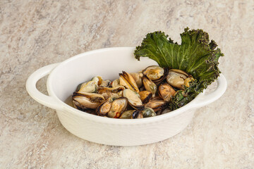 Tasty marinated mussels in the bowl