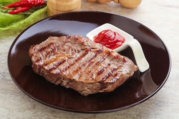 Grilled rib-eye steak beef meat