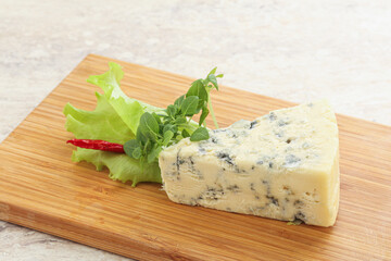 Blue cheese piece over board