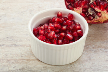 Ripe red Pomegranate seeds in the bowl