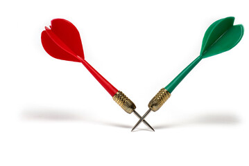 Closeup two darts crossed tips white background