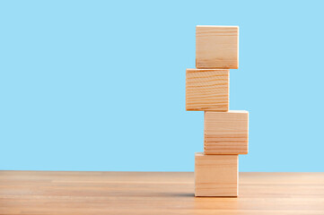Blank wooden block cubes on a blue background for your text. free space for business concept template and banner..