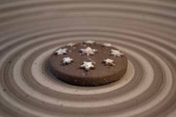 Delicious, crunchy biscuit. Served on an elegant ceramic plate. In shades of brown, which are in tune with the colors of the biscuits.