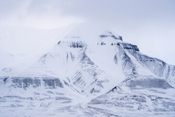 Close-up of a snowy mountain. Northern landscape texture. Norway, Svalbard.